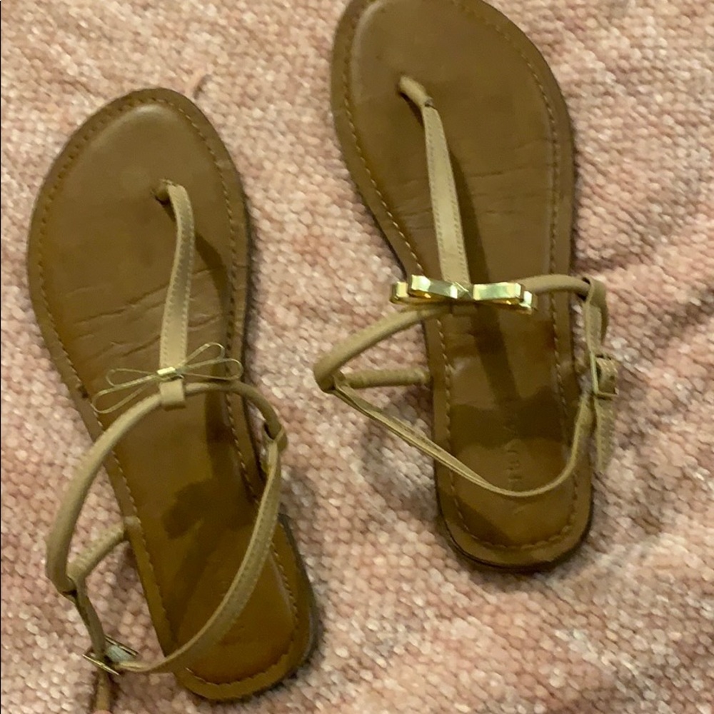 Tan and light pink sandals with gold bow